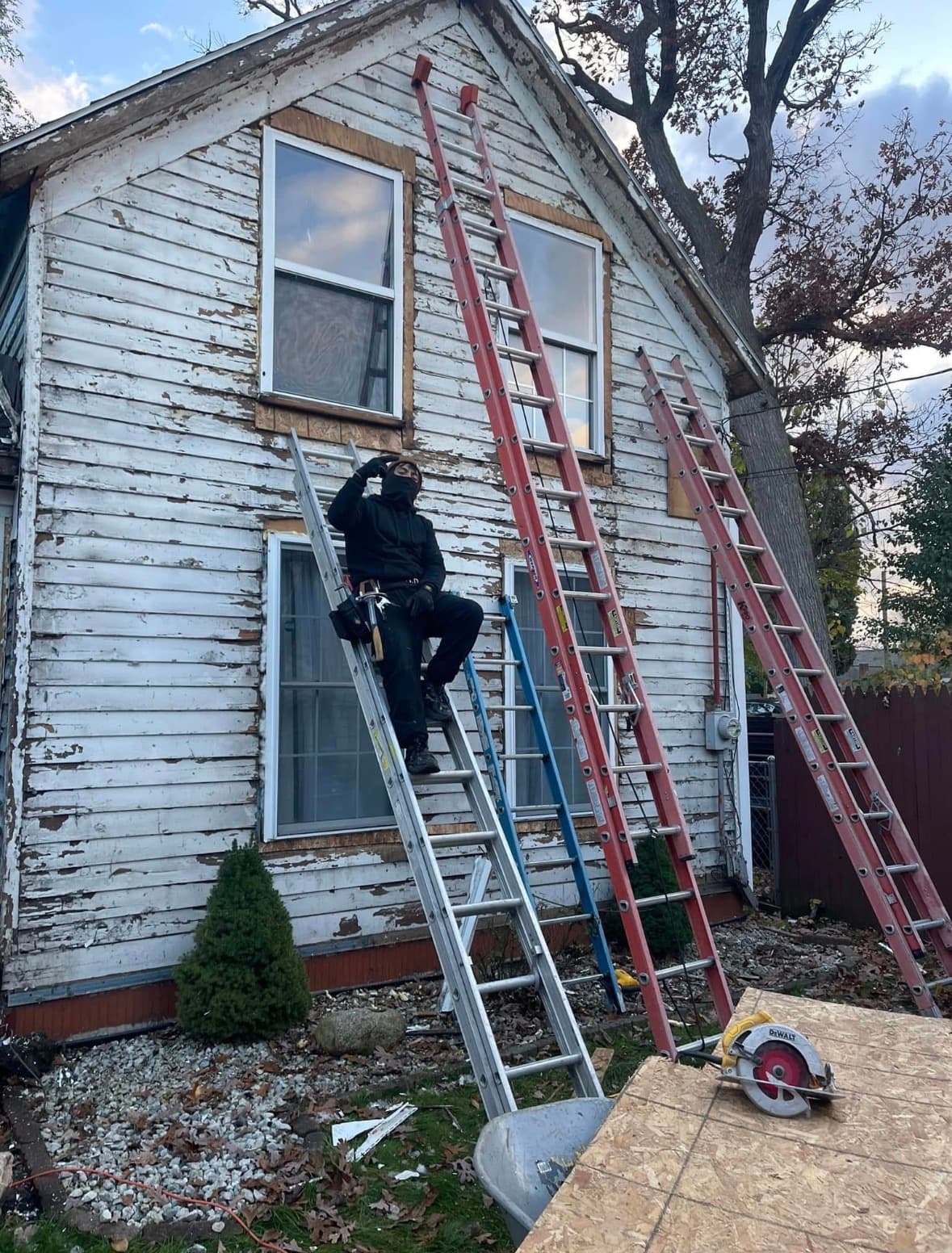 Home before: peeling, weathered original siding